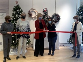 Megan Johnson, executive director of the PADDLE Program and Tammy Morison, president and CEO of the North Bay Regional Health Centre Foundation, cut the ribbon to kick off the Festival of Trees and All Things Christmas which takes place online and at Northgate Shopping Centre. 
Jennifer Hamilton-McCharles, The Nugget