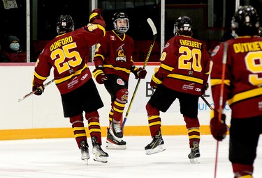 Timmins Rock forward Dylan McElhinny celebrates his first-period goal with teammates, from left, Bode Dunford, Christopher Engelbert and Cameron Dutkiewicz during Sunday afternoon’s NOJHL game at the McIntyre Arena. McElhinny’s goal staked the Rock to a 1-0 lead in a game they would go on to win 5-2. McElhinny was ejected from the contest late in the third period after being assessed a five-minute major for head contact and a game misconduct. THOMAS PERRY/THE DAILY PRESS