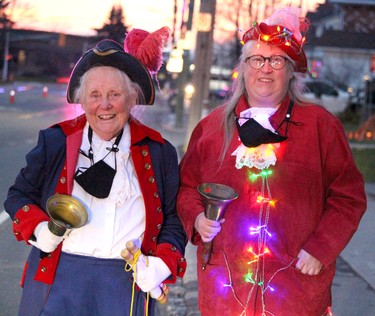 Rotary Reverse Santa Claus Parade on Queen Street East on Saturday, Nov. 20, 2021 in Sault Ste. Marie, Ont. Mary Rossiter and Caroline Duke town criers. (BRIAN KELLY/THE SAULT STAR/POSTMEDIA NETWORK)