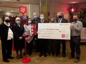 Celebrating a $50,000 donation from the Lougheed Foundation to the Salvation Army on Friday were, from left, Lyn Mullen, Captain Deb Vanderheyden, Emily Mantle, Geoffrey Lougheed, Captain Jim Vanderheyden, Shannon Kenrick-Rochon, Gerry Lougheed Jr. and Trevor Gilcrest.