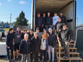Players and staff from the French River Rapids showed many hands can make for a relatively light day's work during a recently volunteering session at the Britt Community Food Bank.