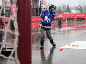 John Tunks tests his wristshot Sunday afternoon at the Rogers Hometown Hockey festival in Tillsonburg. His best shot came in at 35 km/h on the hockey radar gun. (Chris Abbott/Norfolk and Tillsonburg News)