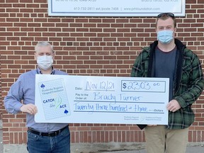Brady Turner, left, won the Pembroke Regional Hospital Foundation week #16 weekly pot amount of $2,303 after his ticket #P-2632556 and card #46, revealed the six of diamonds after being selected through the online random generator. Foundation executive director Roger Martin presents Turner with his cheque. Submitted photo
