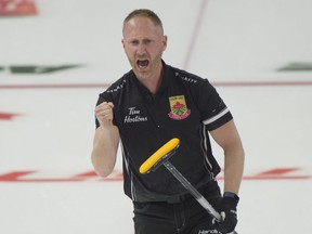 Sault Ste. Marie skip Brad Jacobs  pumps his fist after guiding his team to 7-5 victory over Team Gunnlaugson in draw 10 of the Canadian Olympic Trials in Saskatoon.