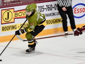 Michael Podolioukh of the North Bay Battalion guards the puck against James Guo of the host Peterborough Petes in Ontario Hockey League play Thursday night. The Troops visit the Kingston Frontenacs on Friday night.
Sean Ryan Photo