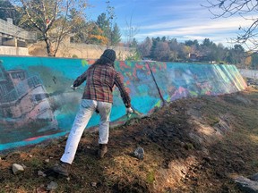 Nomi Drory works on the 90-foot concrete retaining wall by the locks of the Magnetawan River. The completed work features the water vessels that used the river system from the 1800s to the present.
Laura Brandt Photo