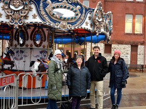 This weekend's Winter Wander-land event in Market Square will support downtown businesses as well as a new Stratford social-services-resource centre funded and operated by the City of Stratford, the United Way Perth-Huron and Choices for Change called The Connection Centre that is set to open before the end of the year. Pictured in front of the holiday carousel in Market Square are Stratford City Centre BIA membership and animation lead Kim Griffiths, Choices for Change executive director Catherine Hardman, United Way Perth-Huron executive director Ryan Erb and BIA general manager Rebecca Scott. Galen Simmons/The Beacon Herald/Postmedia Network