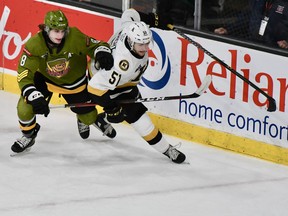 The North Bay Battalion's Avery Winslow covers Shane Wright of the Kingston Frontenacs in their Ontario Hockey League game Friday night in the Limestone City. The Battalion completes a three-game eastern swing Saturday afternoon against the Ottawa 67's.
Sean Ryan Photo