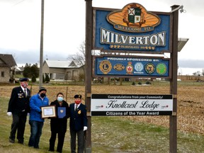 More than three months after the staff and community at Knollcrest Lodge long term care home were named the winners of the Milverton Business Association's 2021 Pillars of the Community Award, the lifting of pandemic restrictions and the fact that Knollcrest is currently not in the midst of a COVID-19 outbreak allowed CEO Jackie Yost to finally be able to celebrate the designation as citizens of the year Friday afternoon on behalf of her colleagues and residents. Pictured from left next to the Welcome to Milverton sign at the north end of town are Milverton Legion past president Fritz Ryter, Milverton Business Association president Jeremy Matheson, Yost and Milverton Legion president Marilyn Dale. Galen Simmons/The Beacon Herald/Postmedia Network