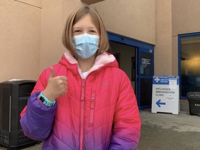 Nine-year-old Katherine Wyman of Sherwood Park was all smiles, regardless of her mask, following her vaccination appointment for the Pfizer-BioNTech pediatric vaccine on Friday, Nov. 26. Lindsay Morey/New Staff