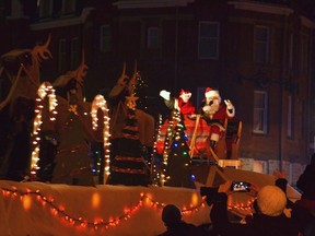 Santa and Mrs.  Claus waved to the kids and their families along Downie Street who had been waiting all evening to catch a glimpse of the man in the red suit during the 2021 Stratford Parade of Lights.  (Galen Simmons/The Beacon Herald)