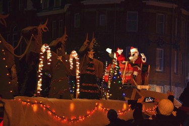 Santa and Mrs. Claus waved to the kids and their families along Downie Street who had been waiting all evening to catch a glimpse of the man in the red suit as the Stratford Parade of Lights passed through downtown Sunday. Galen Simmons/The Beacon Herald/Postmedia Network