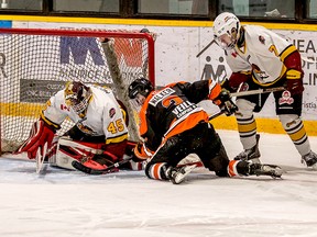 Timmins goalie Gavin McCarthy gets his glove on a loose puck in his crease before Hearst Lumberjacks forward Cody Walker can pounce on it while Rock blue-liner Riley Dubois looks on during Sunday afternoon’s NOJHL game at the Claude Larose Arena. The Lumberjacks knocked off the Rock 6-3 to pull within a single point of top spot in the NOJHL’s overall and East Division standings. The two teams will tangle again at the McIntyre Arena Tuesday, at 7:30 p.m. Marc-ANDRÉ LONGVAL/FOR NOJHL NETWORK