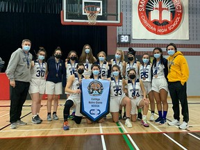 Members of the College Notre Dame girls basketball team celebrate their OFSAA bronze medal.