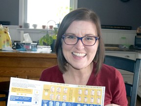 Melissa Snowden is all smiles as she holds up a package of Trikafta, a drug that has already aided tremendously in her constant struggle with Cystic Fibrosis (CF). ANDY BADER