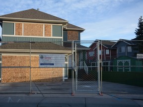The house at 247 Bayside Point NE, fenced off and boarded up. The house operated as a drug house before a SCAN investigation by Alberta Sheriffs resulted in a civic order to close the property for 90 days.