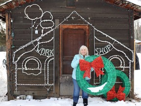 Gwen Dionne decorated Santa's workshop in preparation for the country lights display, set to open Dec. 1.