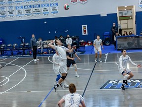 The Keyano Huskies men’s team hits the ball over the net in their game against the University King’s on Friday, November 12, 2021. Photo by Justin Hardy/Outside Optix