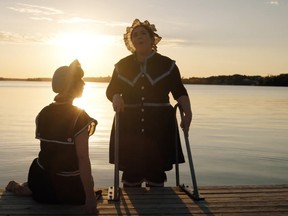 A screenshot from the videos produced by Upriver Media and TrypTych Concert and Opera show Erika Rasmussen, left, and Carrie Hall with a typical northwestern Ontario sunset in the background.