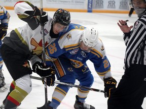 Fort McMurray Oil Barons forward Tyler Wallace and Bonnyville Pontiacs forward Vincent Lamanna battle for the puck at the Centerfire Place on Saturday, October 24, 2020. Laura Beamish/Fort McMurray Today/Postmedia Network