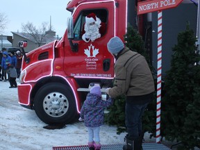 Youngsters were able to meet Santa Claus when Coca-Cola Canada Bottling’s Holiday Truck Tour visited the Leduc Cinemas Nov. 21. (Ted Murphy)