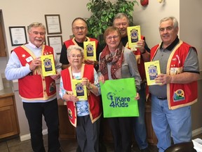 Leduc Lions Club members Tom Crerar, Mike Werenka, Harvey Unger, Tim Sopka and Dorothy Heidman recently presented iKare4Kids fundraiser coordinator Audrey McAmmond with five new tablets. (Leduc Lions Club)