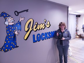 Amber Winters manager of Jim's Locksmith holds up the award from Nipissing Violence Against Women Coordinating Committee.