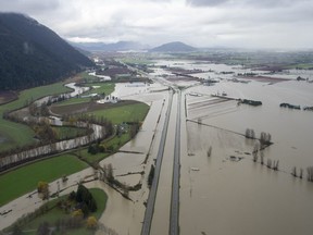 Highway 1 is pictured during a fly over the flood damage in Abbotsford, B.C., Tuesday, November 23, 2021. THE CANADIAN PRESS/Jonathan Hayward