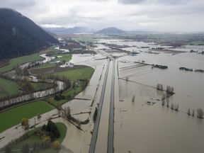 Highway 1 is pictured during a fly over the flood damage in Abbotsford, B.C., Tuesday, November 23, 2021.  THE CANADIAN PRESS/Jonathan Hayward
