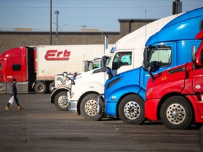 Trucks are parked at the Road King truck stop in Calgary on Wednesday, November 17, 2021. Drivers were waiting for new routes to ports in Vancouver after floods damaged roads in British Columbia. Gavin Young/Postmedia