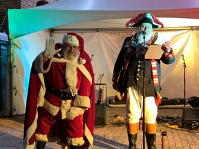 Santa Claus and Town Crier David McKee kicked off the festivities at the city's Holiday Carnival Saturday night with a countdown to the lighting of the giant Christmas tree in the square.