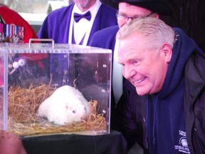 Ontario Premier Doug Ford posed for pictures with Wiarton Willie Feb. 2, 2020, in Wiarton.