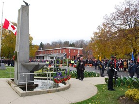 Master Warrant Officer Steve Lehman, right, who served with the Canadian military in Afghanistan, and Master Cpl. John Stinson, who served during the Gulf War and Eritrea, Africa, lay a wreath at the Owen Sound cenotaph in honour of Canadians who served in Afghanistan. The wreaths were laid during Thursday's Remembrance Day ceremony in Owen Sound. DENIS LANGLOIS