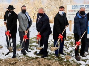 Ontario Premier Doug Ford, centre, flanked from the left by Flato Developments president Shakir Rehmatullah, Southgate Mayor John Woodbury, and on the right by Bruce-Grey-Owen Sound MPP Bill Walker, SEGCHC board chair Larry Mann and Coun. Wayne Hannon from Melancthon, at a ceremonial ground-breaking for a new health centre on Monday, Nov. 16, 2021 in Dundalk, Ont. (Supplied)