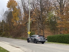 Vehicles travel on the Alpha Street hill on Owen Sound's west side on Tuesday afternoon. The city's draft 2022 capital budget proposes the city begin in 2022 a multi-year project to reconstruct the street from Owen Sound's western boundary to 6th Avenue West. DENIS LANGLOIS