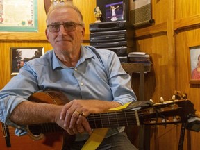 Turns out Ingersoll Mayor Ted Comiskey, photographed in his Irish pub in the basement of his home, is a pretty good singer-songwriter. He released a music video last week of his song Red-Petalled Flower based on his experience seeing a veteran at the town's Memorial Park shortly after Remembrance Day more than 20 years ago. (Mike Hensen/The London Free Press)