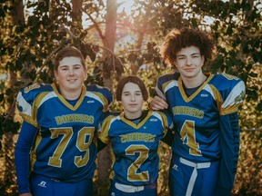 Stony Plain Bombers Caden Fearon (centre), Kohen Sheppard (right), and Angus Ulmer (left) have each been awarded the 'Iron Bomber' award for being longstanding members of the club. Photo by Connie McNeice/BeautiFlow Photography.