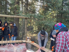 Students attend a hide tanning workshop south of Fort McMurray near Anzac in October 2021. The event was organized by the Nistawyou Association Friendship Centre and Pawâmiw Creative. Photos by Jes Croucher of Pawâmiw Creative