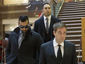 Toronto Police Consts. (left to right) Sameer Kara, Joshua Cabero and Leslie Nyznik leave a disciplinary hearing on Thursday, Dec. 13, 2018 at police headquarters.