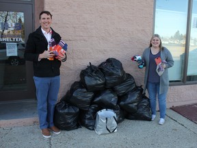 Dr. Bretton Baynes of Baynes Family Wellness dropped off 1,428 pairs of socks with Susan Johnson, executive director of the Leduc Hub Association, Nov. 10. The socks were collected through the fifth annual Toasty Toes program. (Ted Murphy)