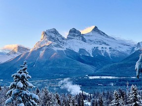 Canmore covered in the first fresh snowfall of the season as the sun rises over The Three Sisters on Oct. 30 2021. Photo Marie Conboy/ Postmedia.
