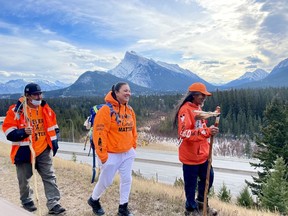 (Left-right) Vernon Dustyhorn, Jasmine Lavallee and Virgil Moar, pass through the Rocky Mountains walking from Winnipeg to Kamloops B.C. embarking on a spiritual journey for the residential school children recovered from unmarked graves, on Nov. 3. 2021. Photo Marie Conboy/ Postmedia.