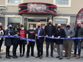 Burger Revolution officially opened its new Downtown District location at 357 Front Street on Tuesday. Joining in the ribbon cutting were, from the left: Luisa Sorrentino, Eileen Brown, Councillor Carol Feeney, Burger Revolution staff, Rayling Camacho, Jeff Camacho, Mayor Mitch Panciuk, David Joyce, Councillor Bill Sandison, Councillor Paul Carr, Mark Rashotte, Peter Kempenaar, and Jill Raycroft. SUBMITTED PHOTO