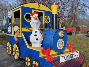 Pictured here in 2019 is two-year-old Gus of Stirling. And though he is still too young to actually drive Engine #9 Ð he loves to imagine he is at the controls. Stirling Rotarian, Donna Graff, is reminding people to look for the miniature, blue & gold locomotive in this yearÕs Stirling Santa Claus Parade, as Rotarians will be walking alongside, accepting unwrapped childrenÕs toys and gifts for the Christmas Toy Drive. You can also bring a toy or a gift to the Rotary ClubÕs Bottle Drive on Nov. 27 at the railway station. TERRY VOLLUM PHOTO