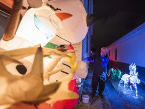 Fred Rushlow oversees some of the inflatable Christmas displays he has amassed over the years. In Belleville, Ontario. ALEX FILIPE
