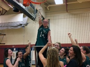 St. John's College student Kailee Mitchell (holding the net) has been a big part of the senior girls basketball team as manager over the past six years.