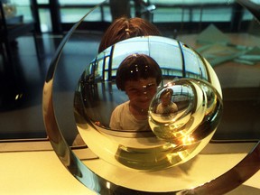 A young visitor gets a fisheye view of the Corning Museum of Glass in Corning, N.Y. The museum boasts it has the finest glass collection in the world.