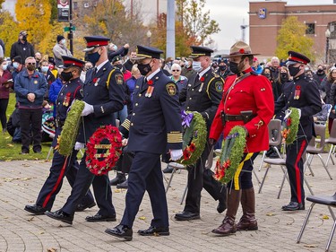 Representatives of local law enforcement and emergency services carry wreaths to lay during Remembrance Day ceremonies on Thursday November 11, 2021 in Brantford, Ontario. Brian Thompson/Brantford Expositor/Postmedia Network