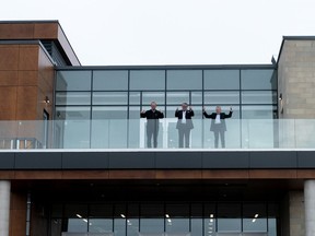 Brant Coun. John Bell (left), Mayor David Bailey and Dr. John McDonald pose for a photo at the Cowan Community Heath Hub in Paris, which opens to the public on Nov. 29.