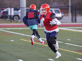 Dorian King of the North Park Trojans runs the ball during a practice this week.